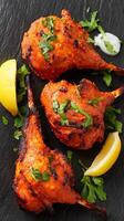 Delicious Tandoori Lamb Chops with Lemon and Fresh Herbs. photo