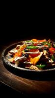 Delicious Nachos with Melted Cheese, Jalapenos, and Tomatoes. photo
