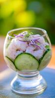 Fresh Shrimp Cocktail with Cucumber and Red Onion in a Glass. photo