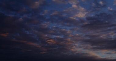 A plane flying in the sky with clouds photo