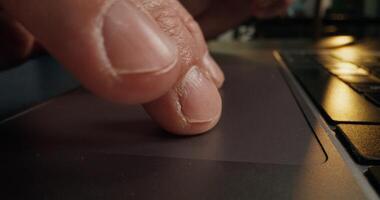 A person's finger on a laptop keyboard photo