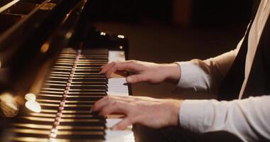 A person is playing the piano with their hands photo
