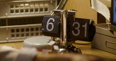 A desk with a clock on it photo