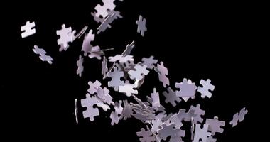 A pile of white puzzle pieces falling to the ground photo