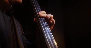 A close up of a man playing a cello photo