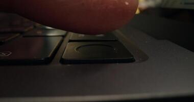 A finger on a laptop keyboard photo