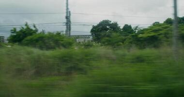 A blurry image of a train passing through a field video