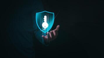 Concept of online login with password for cyber security. User is showing key on hand to communicate data privacy protection and digital threats, key to success, hacker protect data. photo
