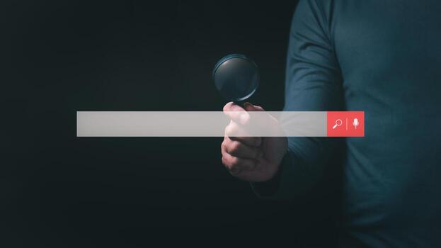 Big data internet network concept, man using magnifying glass to communicate searching for information on the internet, SEO search engine optimization, surfing the internet photo