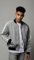 Young Man Standing Confidently in Casual Gray Jacket for Design Mockup photo