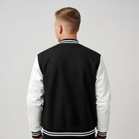Rear View of a Man Wearing a Stylish Black and White Jacket for Design Mockup 1 photo
