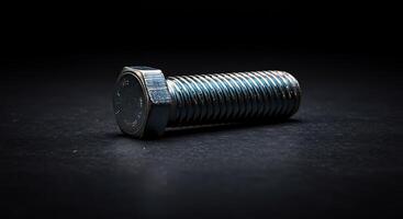 A screw on a black surface photo