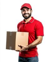 Smiling delivery man in red uniform holding a cardboard box against a white background photo