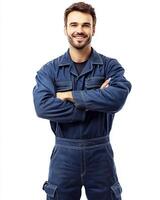 smiling man in blue work overalls with arms crossed on a white background studio shot photo