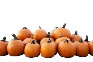 A group of orange pumpkins stacked together against a white background in a studio shot photo