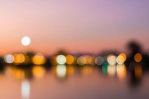 Blurred light of city at sunset with bokeh effect photo