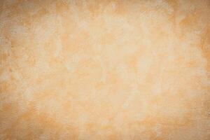 A brown and tan wall with a white paint photo