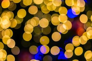 A close up of a colorful christmas tree with lights photo