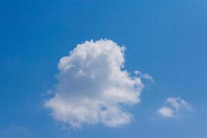 A large white cloud in the blue sky photo