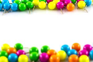 Colorful push pins on a white background photo