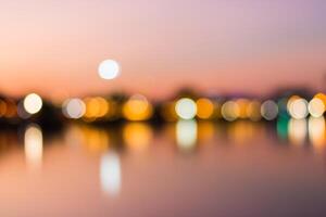 Blurred background of city lights at sunset photo