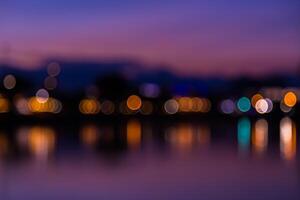 A blurry photo of lights on the water at night