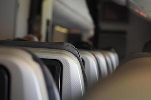 Passengers seated in an airplane preparing for takeoff photo
