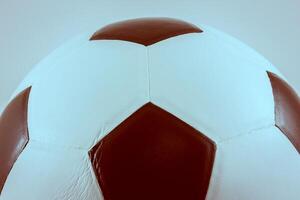 A soccer ball with a white and brown design photo