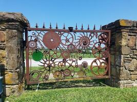 Rusty Steampunk Style Gate of Gears and Wheels in Carthage, Missouri, Route 66 photo