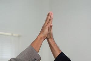 Handshake and Agreement. Close-up of two hands shaking, symbolizing a successful business partnership. photo