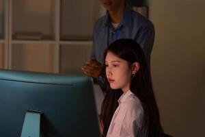 Woman working on a computer screen photo