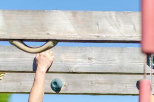 Detail of a hand and arm during an outdoor fitness session. photo