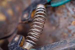 Close up Detail of a Mechanical Spring on Old Shears photo