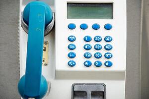 Retro style payphone with buttons and a digital screen. photo