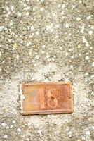 Weathered Metal Plate Forty Eight Grungy Concrete Background photo