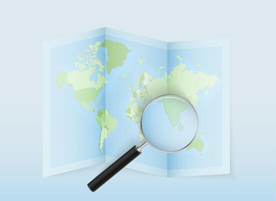 A folded world map with a magnifying lens pointing towards Maldives. Map and flag of Italy in loupe.