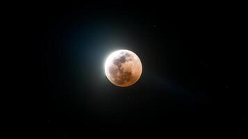 Stunning view of a lunar eclipse with shadow covering the moon and glowing light in the background, celestial event captured beautifully photo