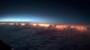 Breathtaking View of Cloud Edges Illuminated by Sunset Above the Earth's Atmosphere photo