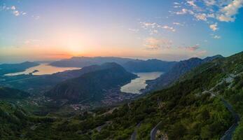 Sunset panorama of Balkan Montenegrin mountains Kotor Bay photo