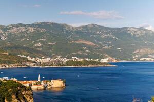 Bird's eye view of towns of Budva and Becici with hotels and bea photo