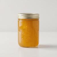 delicious pineapple jam in a jar on a white background photo