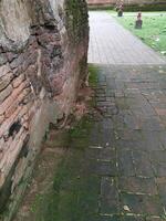 walkway by ancient brick background photo