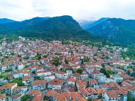 Greek town of Litochoro with small houses against the backdrop o photo