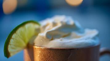 Refreshing Cold Drink with Cream and Lime Wedge. photo