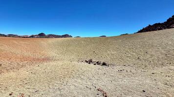 The Breathtaking Stunning Landscape Exhibiting Colorful Earth Formations Beneath a Clear Blue Sky photo