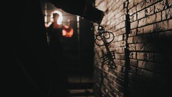 Silhouette holding keys in dark environment video