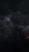 Captivating smoke and fire sparks dance in the dark sky video