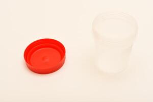Lidded sample test jar. Jars for urine and fecal tests. Containers for medical tests. photo