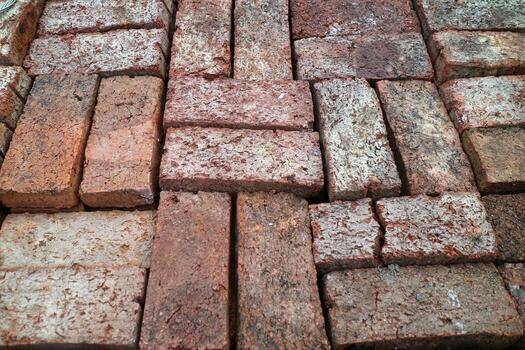 Textured Brick Surface in a Herringbone Pattern photo