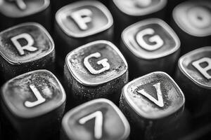 Close-up view of dusty typewriter keys showing signs of wear and tear photo